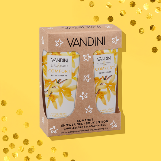 VANDINI Crafted Duo Weihnachtsgeschenkset mit goldenem Konfetti im Hintergrund