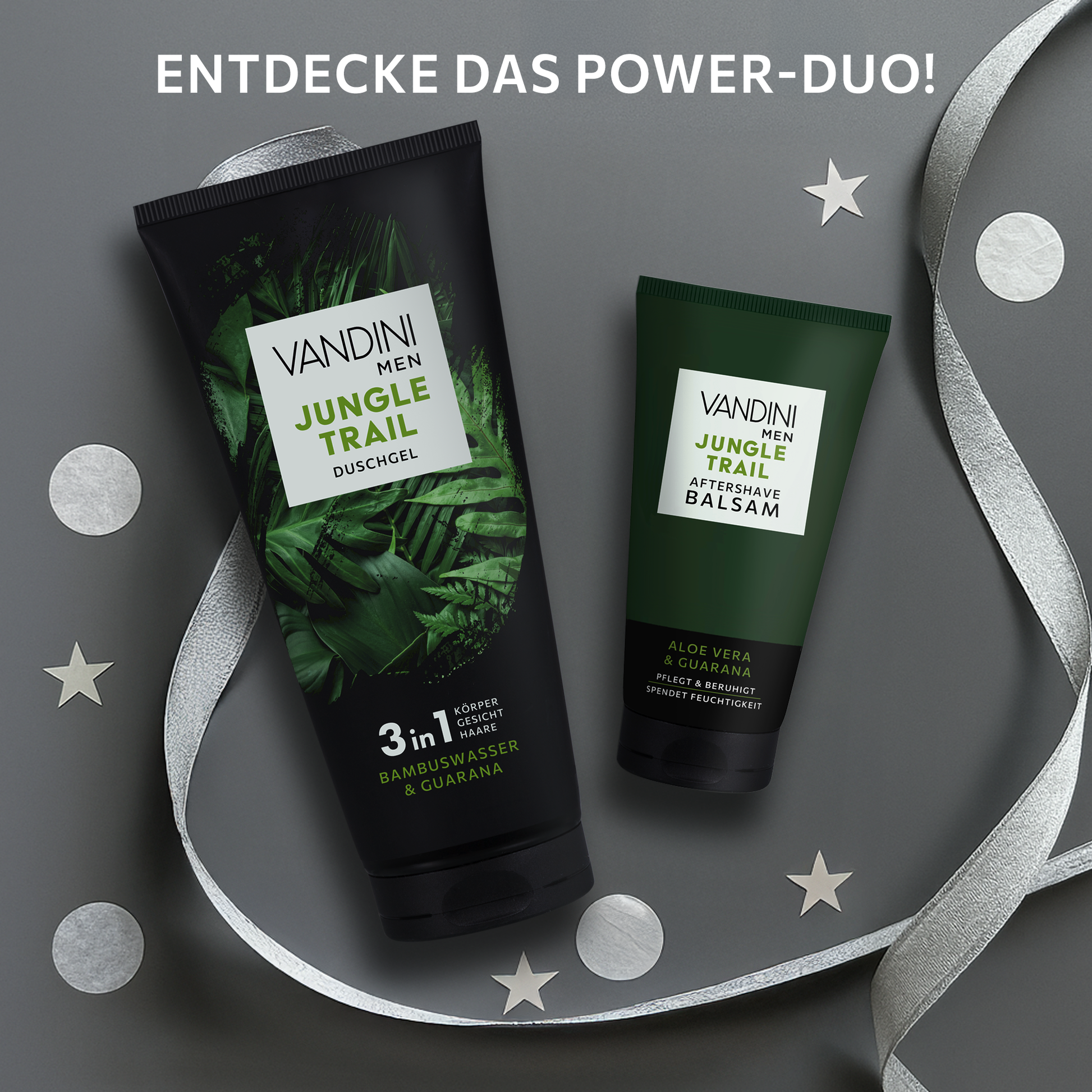 VANDINI MEN JUNGLE TRAIL Duschgel und Afterschafe Balsam vor grauem Hintergrund mit silbernem Konfetti und Bändern